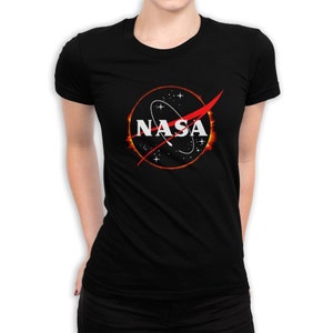 May include: Black t-shirt with a white NASA logo inside a red and orange solar eclipse ring.