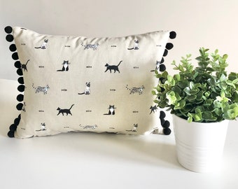 Sophie Allport Purrfect design cushion with pom-poms