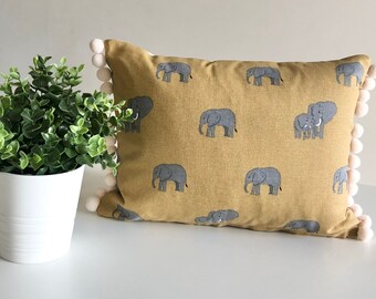 Sophie Allport elephant design cushion with pom-poms