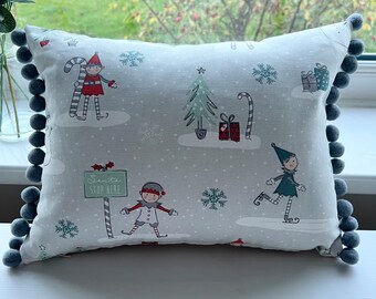 Christmas design cushions with pom-poms