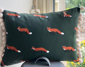 Sophie Allport fox design cushion with pom-poms