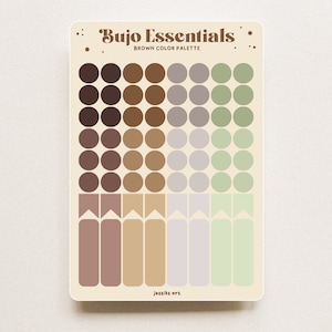 Puede incluir: Una hoja de pegatinas circulares y rectangulares de color marrón, beige, morado y verde. Las pegatinas están etiquetadas con "Bujo Essentials BROWN COLOR PALETTE".