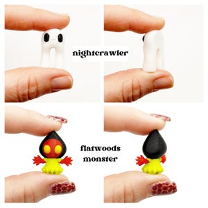 May include: Miniature figurines of cryptids, including a white nightcrawler with black eyes and a Flatwoods Monster with a black head, yellow body, and red arms. The text "nightcrawler" and "flatwoods monster" are displayed.