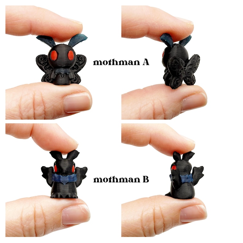 May include: Four small, black Mothman figurines are displayed. Two are labeled "mothman A" and two are labeled "mothman B". Each figurine has red eyes and blue accents. The figurines are held between fingers.