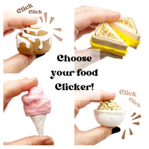 May include: A selection of miniature food clickers, including a cinnamon swirl, a toasted sandwich, a pink ice cream cone, and a bowl of cereal. The text "Choose your food Clicker!" is displayed.
