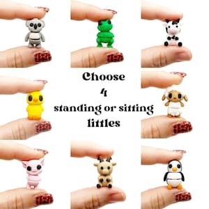 May include: A collection of eight miniature animal figurines including a koala, frog, cow, chick, sheep, pig, goat, and penguin. The text in the center reads Choose 4 standing or sitting littles. Each small figure is held between thumb and forefinger.