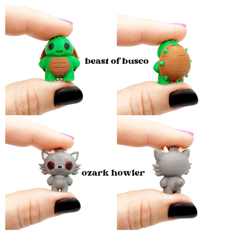 May include: Four small figurines: a green turtle with a brown shell, and a gray wolf-like creature. The turtle is labeled "beast of busco" and the wolf is labeled "ozark howler". The figurines are held up by fingers.