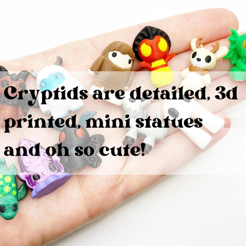 May include: A collection of colorful, 3D-printed mini cryptid statues. The statues are in various shapes and colors, including white, brown, red, and purple. The text on the image reads "Cryptids are detailed, 3d printed, mini statues and oh so cute!"