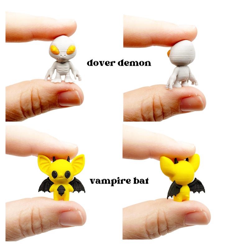 May include: Miniature figurines of a Dover Demon and a vampire bat. The Dover Demon is gray with yellow eyes, and the vampire bat is yellow with black wings. The text "dover demon" and "vampire bat" are printed on the image.