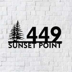May include: Black metal house number sign with the number 449 and the words "SUNSET POINT" below. The sign features a silhouette of two pine trees.