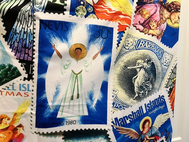 May include: Fabric with a collage of postage stamp designs. Stamps depict angels, including one from "Nevis" in white robes, another from "Barbados", and "Marshall Islands" with "Midnight Angel" text. The stamps are set against a white background.