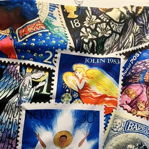 May include: A fabric printed with a collage of postage stamps. The stamps showcase angels, floral patterns, and portraits, with text including "JOLIN 1983" and "BARBADOS". The main colours are blue, white, yellow, and pink.