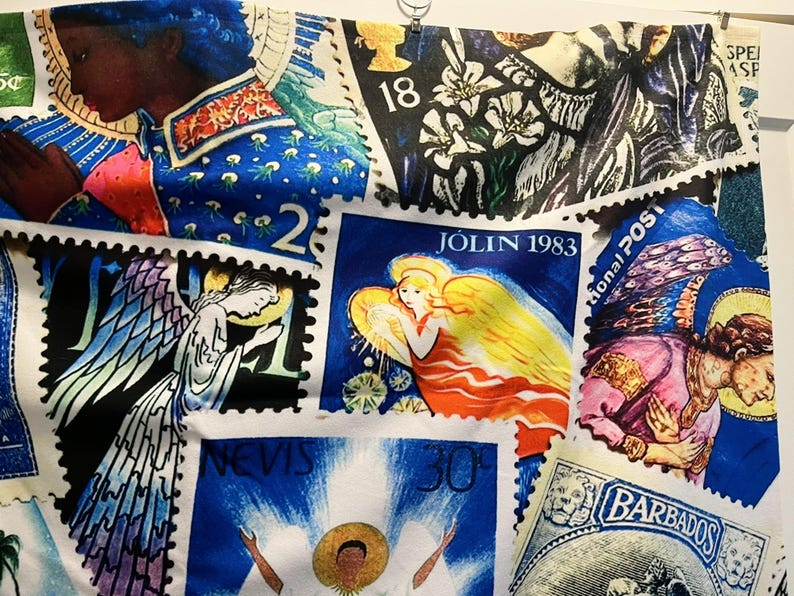 May include: A fabric printed with a collage of postage stamps. The stamps showcase angels, floral patterns, and portraits, with text including "JOLIN 1983" and "BARBADOS". The main colours are blue, white, yellow, and pink.
