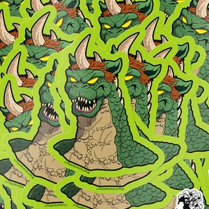 May include: A stack of green, brown, and red monster stickers. The monster has a green body, red hair, and a large horn. The stickers are on a green background. Due to variations in monitors and browsers, colors may appear different than in person. Please read info panel for size and details.