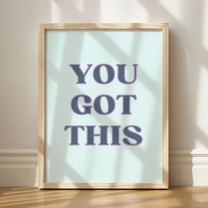 May include: A framed print with a light blue background and the text "YOU GOT THIS" in dark blue letters with a purple outline.