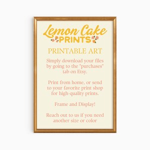 May include: A printable art design with the text "Lemon Cake Prints" in yellow with pink flowers. The text "Printable Art" is in pink. The text below explains how to download the files and print them at home or at a print shop.