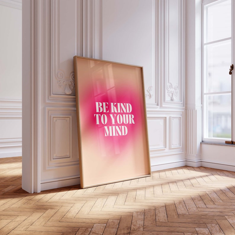 May include: A framed print with a pink and orange gradient background. The text "BE KIND TO YOUR MIND" is in white letters.
