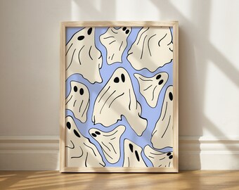 May include: A framed print featuring a light blue background with a pattern of white ghosts with black eyes. The ghosts are of various shapes and sizes.