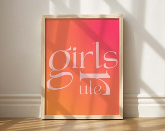May include: A framed print with a gradient background transitioning from orange to pink. The text "girls rule" is printed in white on the print.