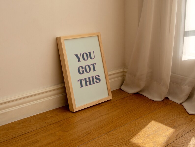 May include: A framed print with a light green background and the text "YOU GOT THIS" in dark gray letters.