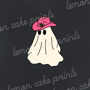 May include: A white ghost wearing a pink cowboy hat with a green leaf design. The ghost has two black eyes and a simple smile. The background is black.