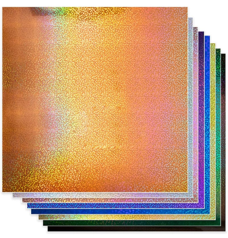 May include: A stack of 10 sheets of iridescent holographic paper in various colors, including gold, silver, blue, green, and purple. The paper has a textured, sparkly finish.