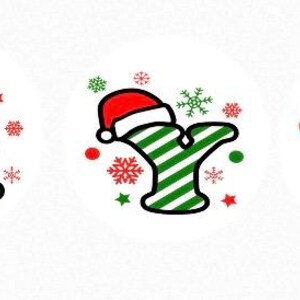 May include: Three Christmas-themed letters, X, Y, and Z, with red and green striped patterns. Each letter is wearing a red Santa hat with a white trim. The letters are surrounded by snowflakes and stars.
