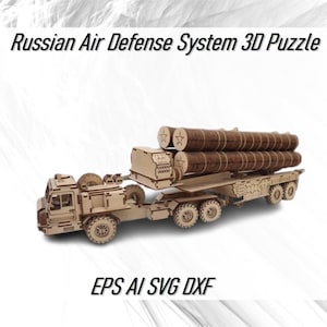 May include: A wooden 3D puzzle model of a Russian air defense system. The model is made of laser-cut wood and features a truck with a missile launcher. The truck has four wheels and a cab with a windshield. The missile launcher is mounted on the back of the truck and has four missiles. The model is painted in a camouflage pattern.
