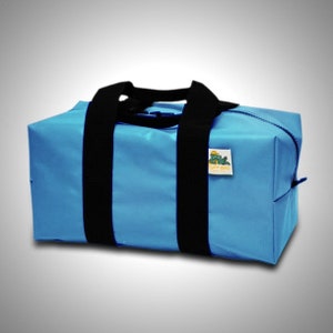May include: A light blue duffel bag with black straps and a green and yellow logo that says "LIFT BAG".