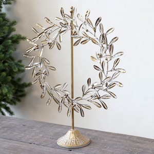 Gold metal leaf wreath with stand