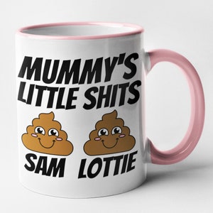 May include: White ceramic mug with a pink rim and handle. The mug has a black graphic that says "Mummy's Little Shits" with two cartoon poop emojis underneath. The poop emojis have smiling faces and the text "Sam" and "Lottie" underneath.
