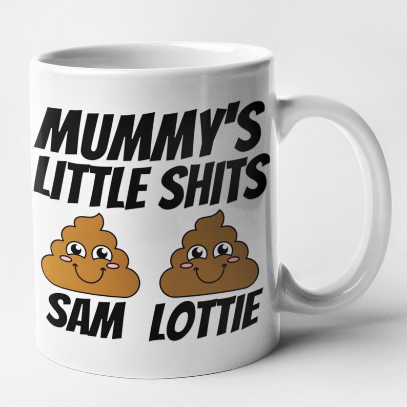 May include: White ceramic mug with black text that reads "Mummy's Little Shits" and two cartoon poop emojis with smiling faces. The text "Sam" and "Lottie" are written below the emojis.