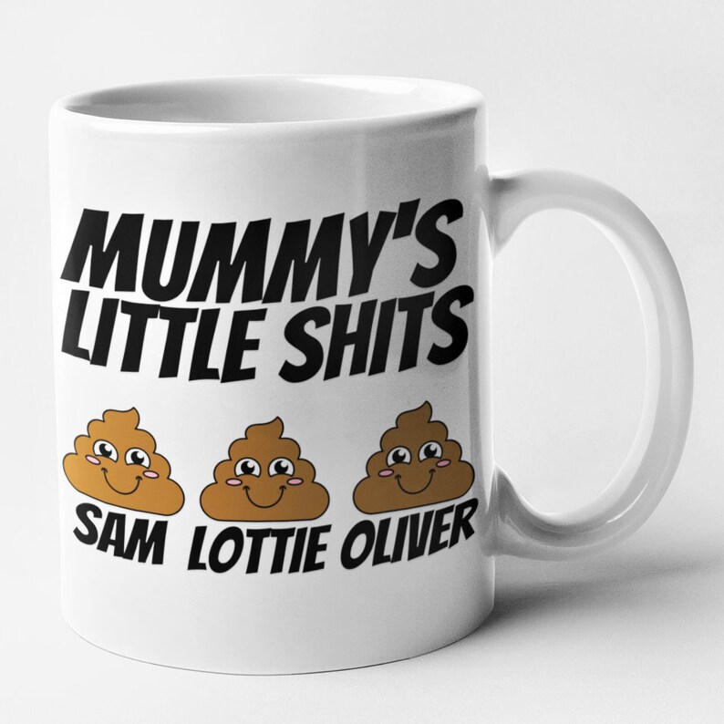 May include: White ceramic mug with black text that reads "Mummy's Little Shits" and three brown cartoon poop emojis with smiling faces. The emojis are labeled "Sam", "Lottie", and "Oliver".