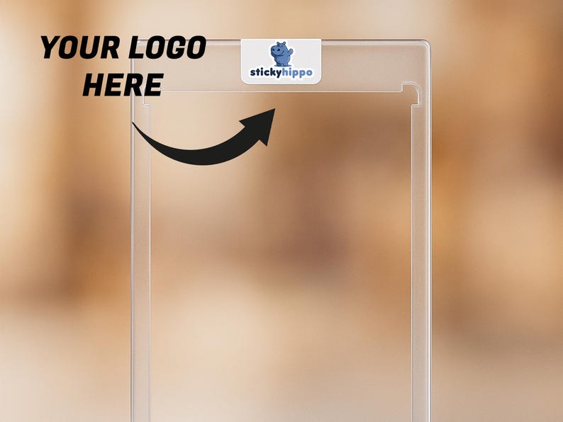 May include: A clear, rectangular plastic case with a small white label that reads "stickyhippo" and features a blue hippo logo. The words "YOUR LOGO HERE" are in bold black text. A black arrow points towards the case.