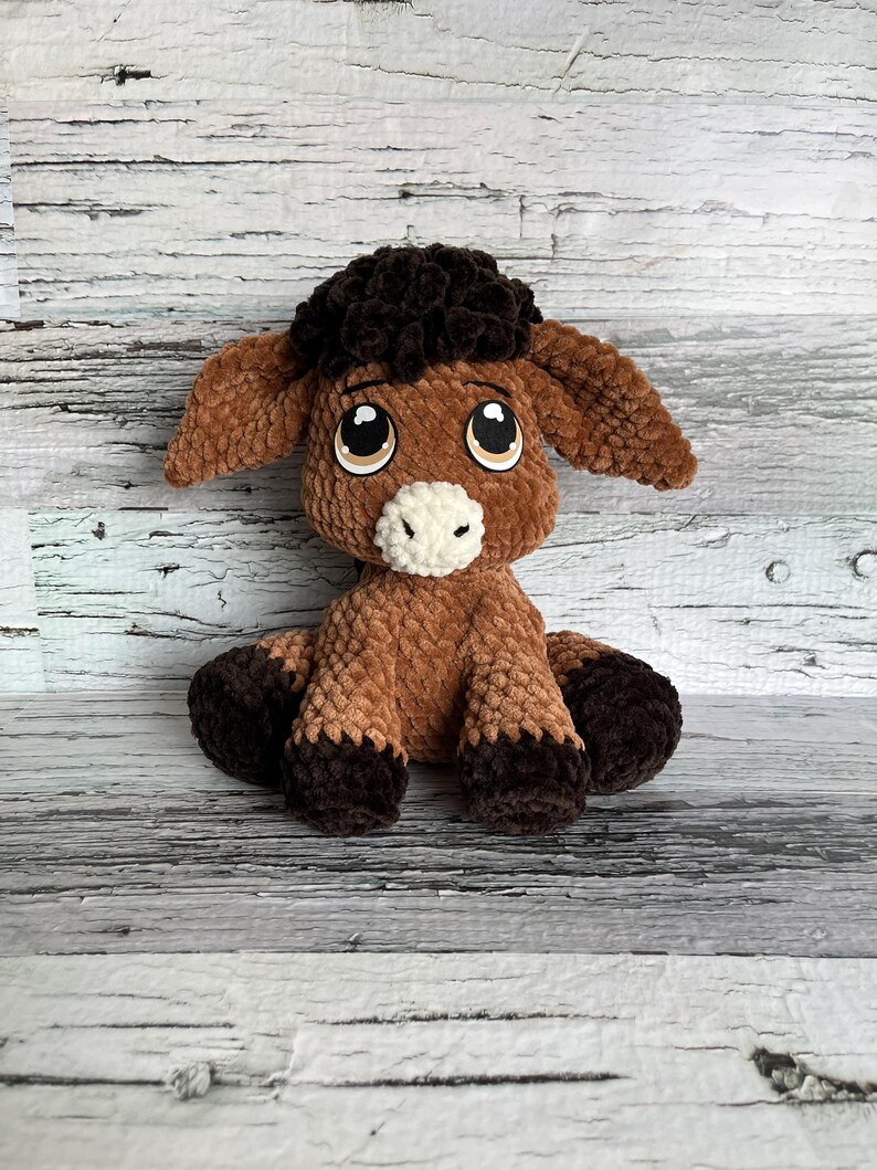 Front view of brown Dylan the Donkey plushie made with soft chenille yarn and felt eyes.