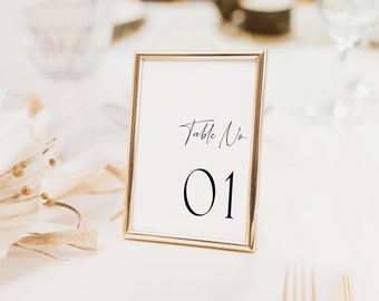 May include: Gold-framed table number card with a white background and black text. The card reads "Table No. 01".