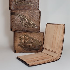 Cartera con fósiles de dinosaurios