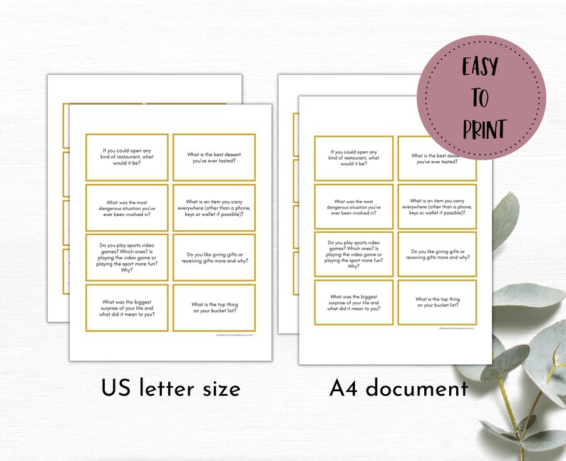 May include: Two sets of printable cards with gold borders and white backgrounds. Each card has a question printed on it in black text. The questions are about personal experiences, preferences, and opinions. The cards are labeled "US letter size" and "A4 document".