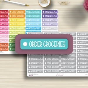 May include: A sheet of colorful and gray planner stickers with the text "ORDER GROCERIES" repeated on each sticker. The stickers are arranged in rows and columns. The stickers are designed for use in a planner or journal.