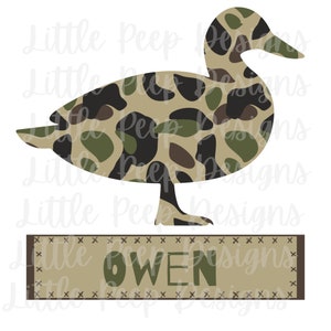 May include: A camouflage duck silhouette with the name Owen in a brown banner with a stitched border.