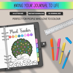 May include: A journal with a "Mood Tracker" page, featuring a tree with colorful flowers and a sleeping cat illustration. The image includes colored pens, a ruler, and text: "BRING YOUR JOURNAL TO LIFE", "A4 LETTER SIZE", "INSTANT DOWNLOAD", "A5 JOURNAL SIZE".