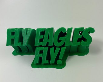 May include: Green 3D printed sign that reads "FLY EAGLES FLY!"