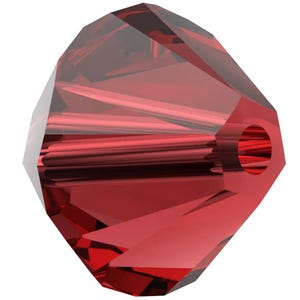 a red crystal bead with a hole in the center, set against a white background.