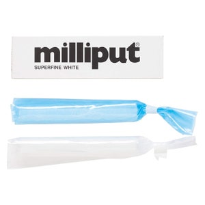 May include: Two tubes of Milliput Superfine White epoxy putty, one blue and one white, wrapped in plastic.