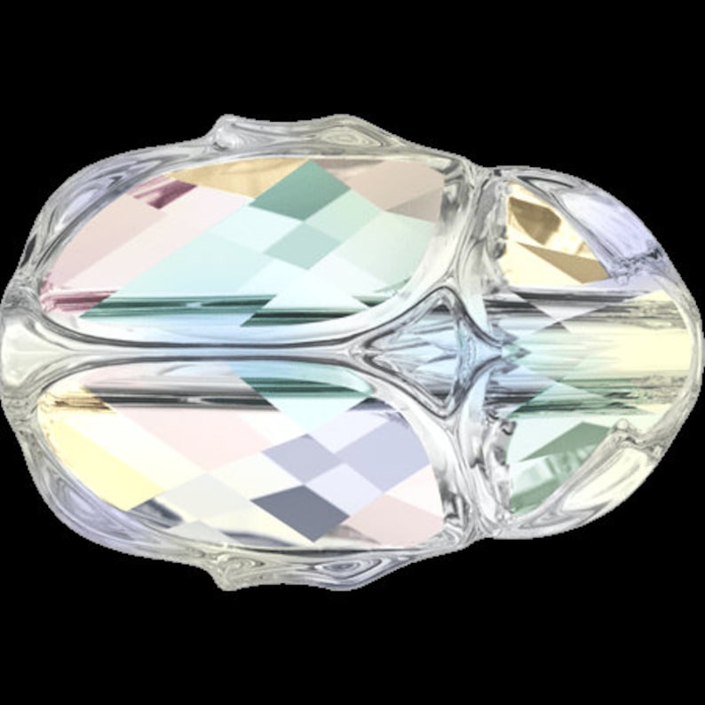 May include: A clear glass bead with a faceted design, featuring iridescent colors of pink, blue, green, and gold.
