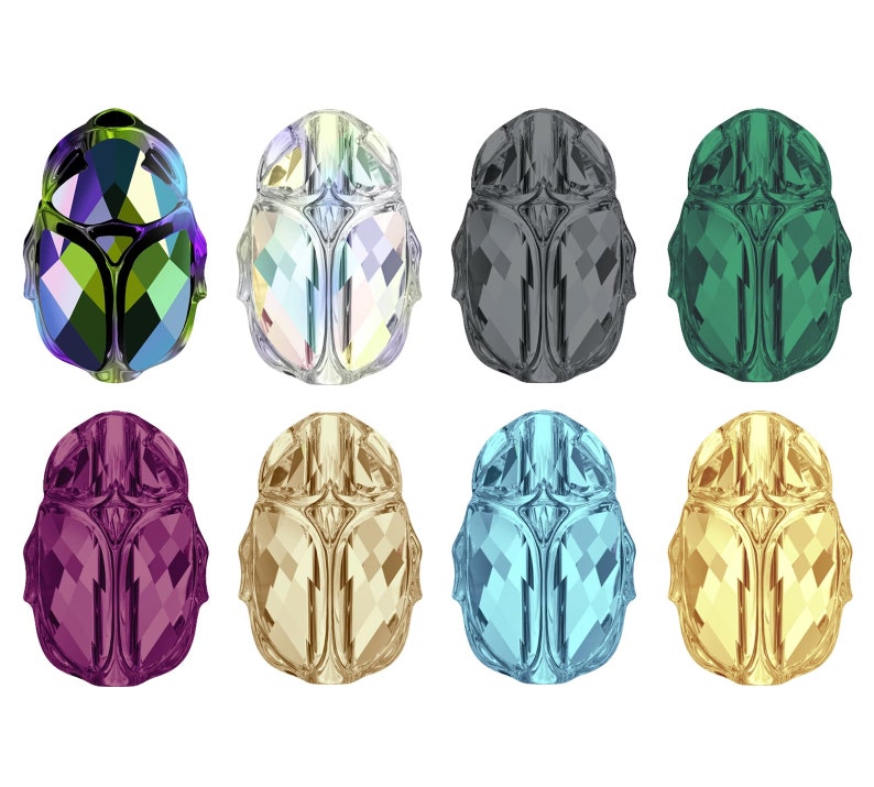 May include: Eight crystal scarab beetles in various colors, including green, blue, purple, gold, and silver. The beetles are faceted and have a detailed design.