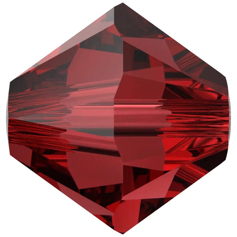 a red gemstone with a unique, diamond-shaped structure.
