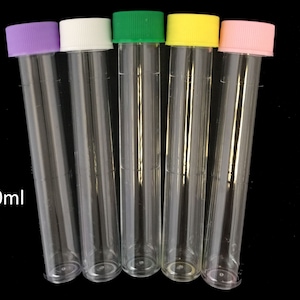 May include: Five clear plastic tubes with colored caps. The caps are purple, white, green, yellow, and pink. The tubes are labeled 10ml.