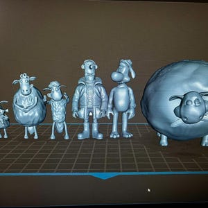 以下が含まれることがあります： 羊、犬、冬のコートを着た男性など、灰色の漫画のキャラクターのフィギュアのコレクション。フィギュアのサイズは異なり、最大は側面に羊の顔が付いた羊です。フィギュアはグリッド上に立っています。