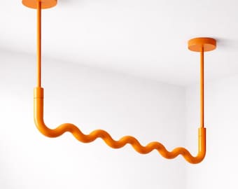 Modern Brass Wavy Ceiling Clothes Rack – Orange Sculptural Garment Rail